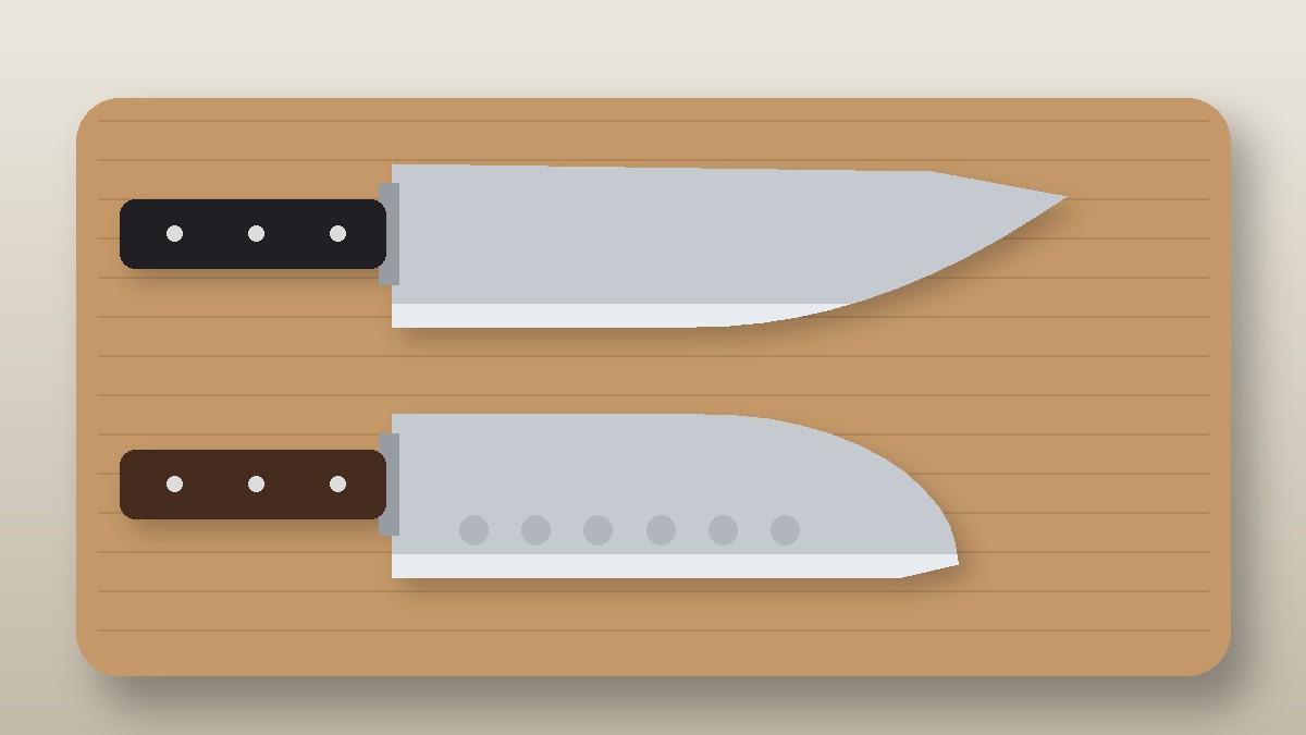 Chef knife and santoku with a hollow edge side by side on a cutting board