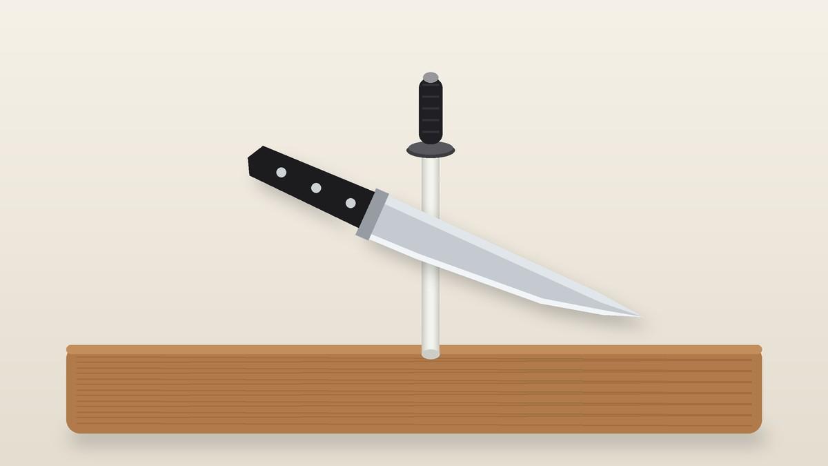 Chef's knife resting against a honing rod on a wooden board
