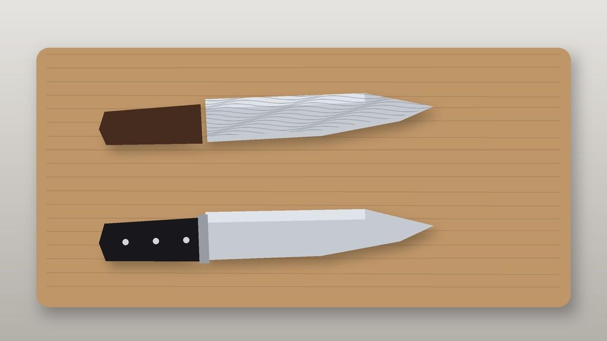 Japanese Damascus chef knife above a German forged chef knife on a cutting board